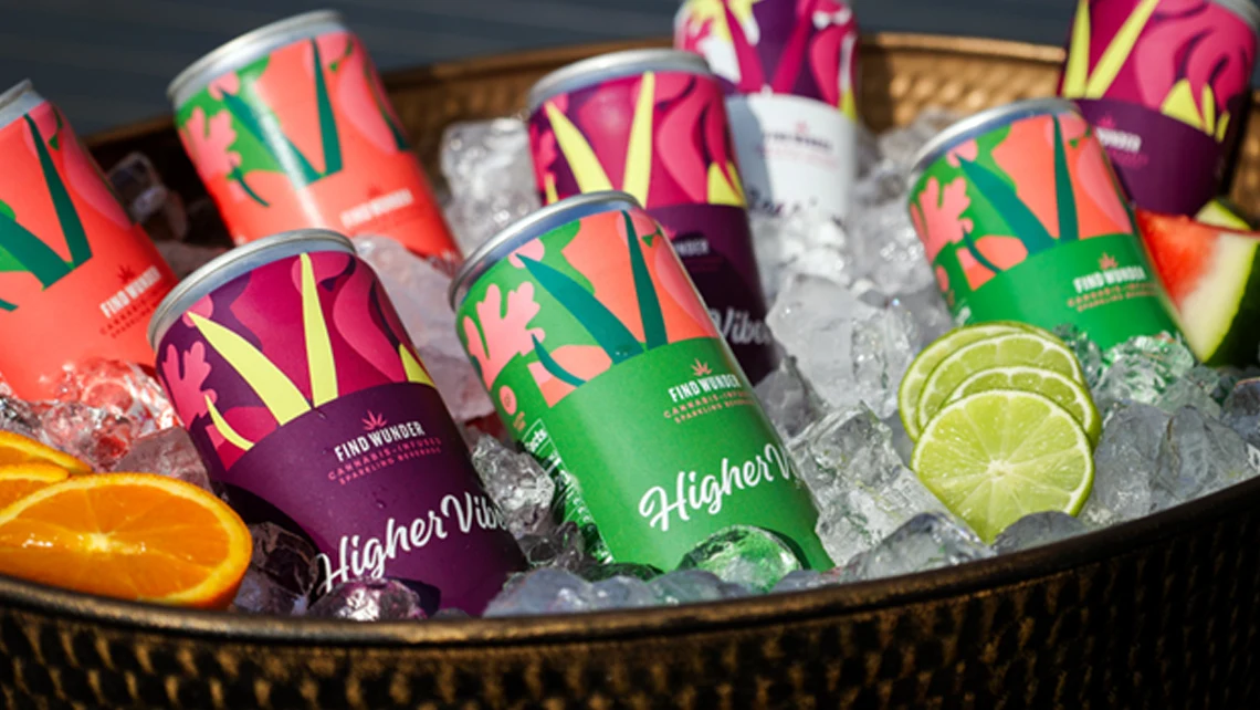 Wunder THC drinks with orange, watermelon, and lime slices in an ice-filled basket