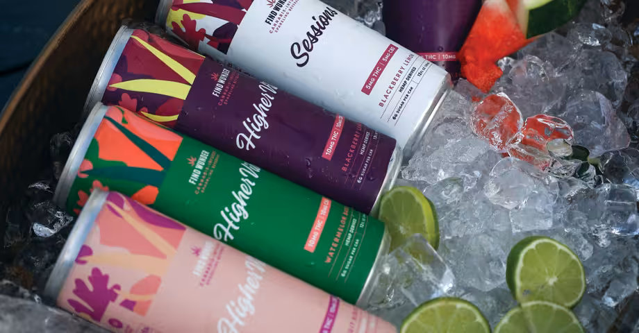 Find Wunder THC seltzers laid in a basket of ice cubes with watermelon wedges and lime slices